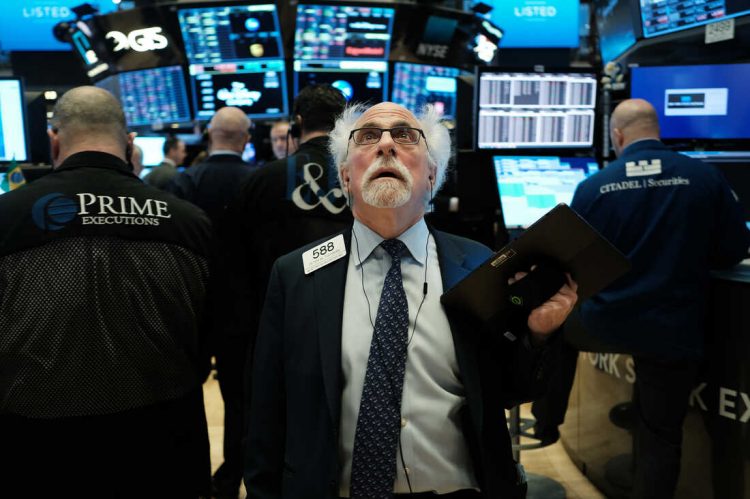 NEW YORK, NEW YORK - MARCH 09: Stock trader Peter Tuchman works on the floor of the New York Stock Exchange (NYSE) on March 09, 2020 in New York City. As global fears from the coronavirus continue to escalate, trading was halted for 15 minutes after the opening bell as stocks fell 7 percent. (Photo by Spencer Platt/Getty Images)