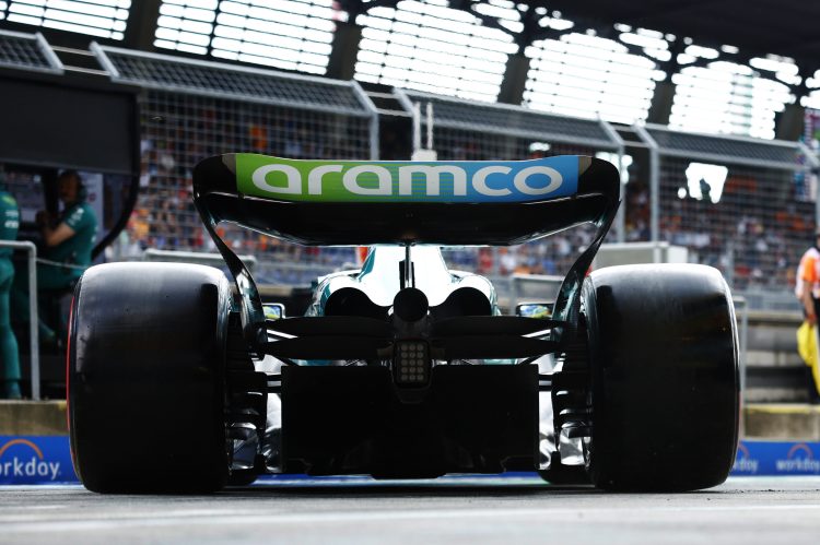 Fernando Alonso, Aston Martin AMR23, leaves the garage