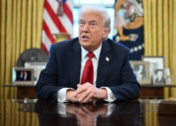 TOPSHOT - US President Donald Trump announces tariffs on auto imports in the Oval Office of the White House in Washington, DC, on March 26, 2025. Trump announced imposition of 25 percent tariffs on all cars and light trucks not built on US soil. "What we're going to be doing is a 25 percent tariff on all cars that are not made in the United States. If they're made in the United States, it is absolutely no tariff," he announced at the White House. (Photo by Mandel NGAN / AFP)